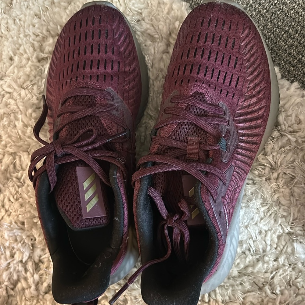 Maroon Adidas tennis shoes